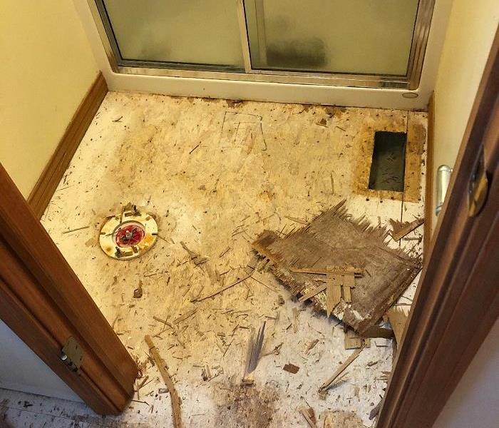 Damaged Bathroom Floor After Flooding